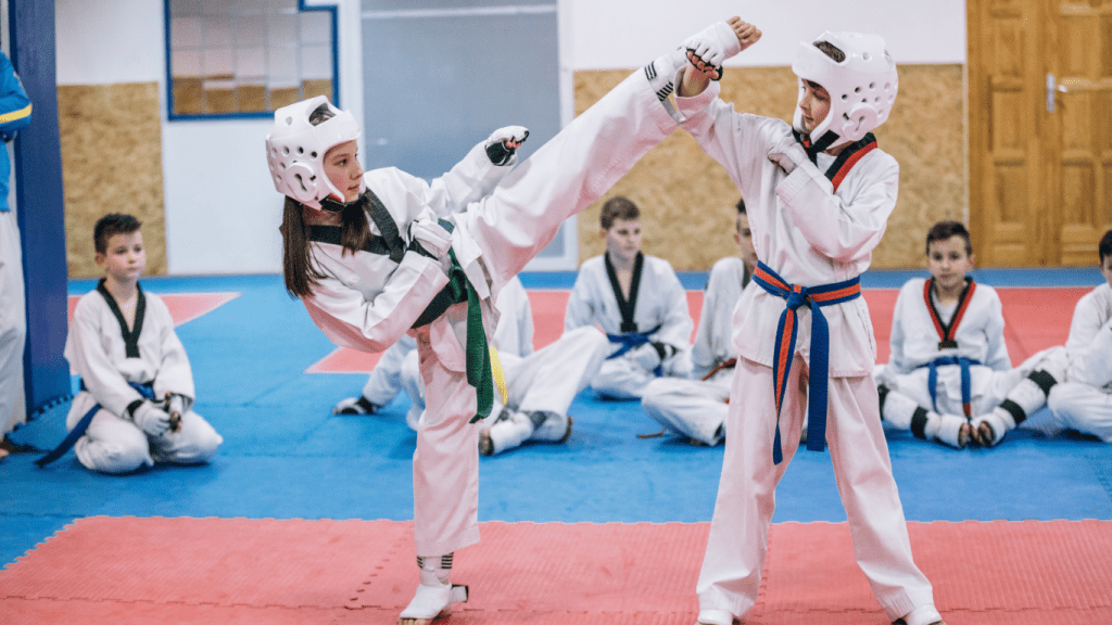 A person practicing self-defense techniques in a martial arts gym.